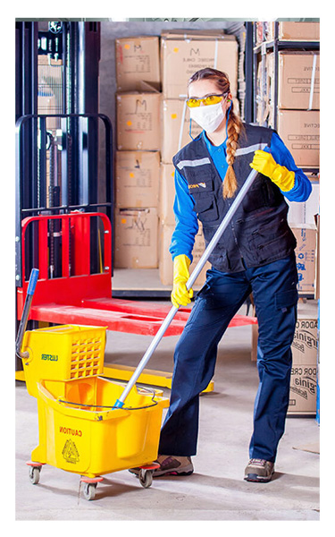 One of the cleaners from Time To Shine in Calgary providing our comprehensive janitorial services to a business client.